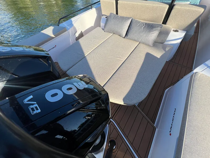 Slide: The Image of 2023 Axopar 37 Sun-Top boat with cushioned seating and twin 300 V8 engines. - 14