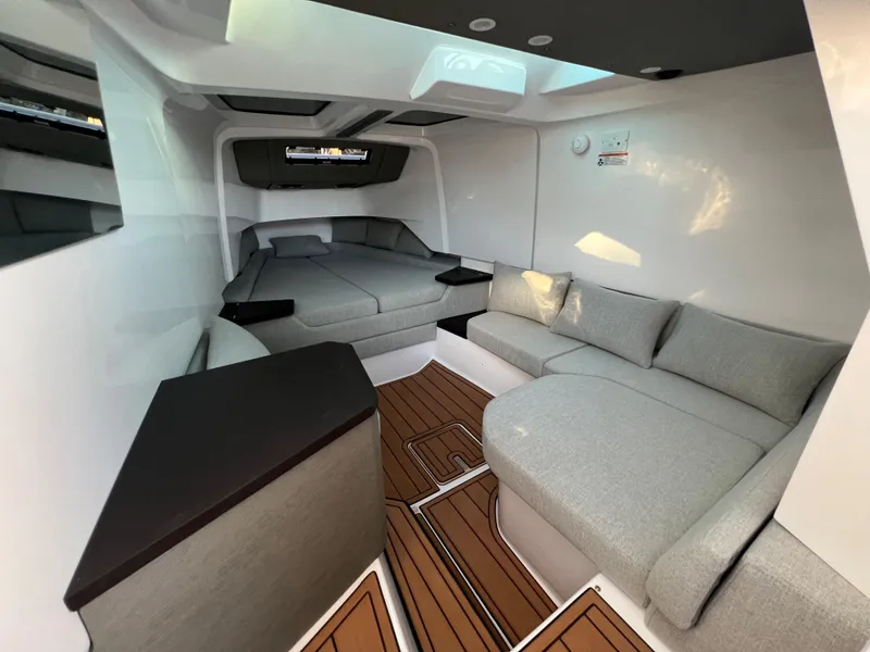 Slide: The Image of Interior of 2023 Axopar 37 Sun-Top with modern seating and bed. - 19