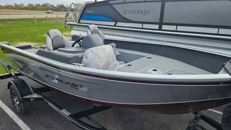 Slide: The Image of 2025 Starcraft Stealth 166 SC boat on trailer, gray color. - 12