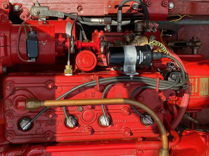 Slide: The Image of 1948 Chris-Craft Sportsman engine, vibrant red, detailed mechanical components. - 8