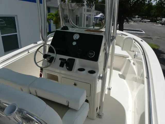Slide: The Image of 2025 Bulls Bay 230CC center console boat interior with steering wheel and seating. - 10