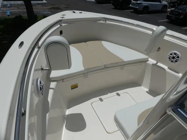 Slide: The Image of Bulls Bay 230CC 2025 model boat interior with cushioned seating and storage. - 12