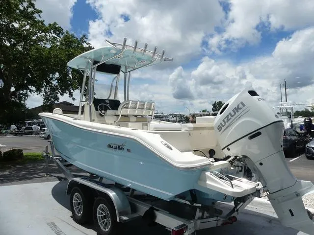 Slide: The Image of 2025 Bulls Bay 230CC boat on trailer with Suzuki outboard motor. - 4