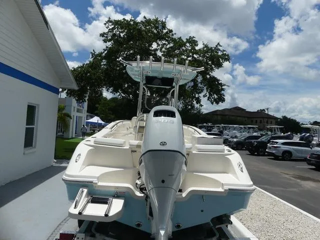 Slide: The Image of 2025 Bulls Bay 230CC boat, rear view, parked outdoors on a sunny day. - 5