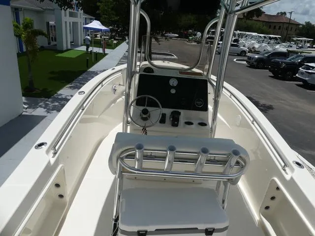 Slide: The Image of 2025 Bulls Bay 230CC center console boat with steering wheel and rod holders. - 9