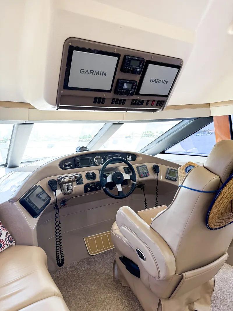 Slide: The Image of Helm of 2006 Carver 560 Voyager with Garmin navigation systems. - 15