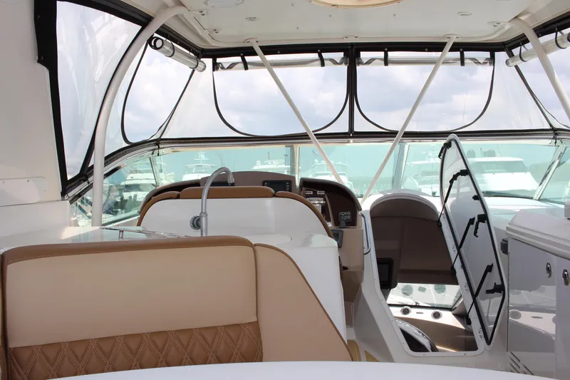 Slide: The Image of Interior of a 2006 Carver 560 Voyager yacht with beige seating and helm station. - 25