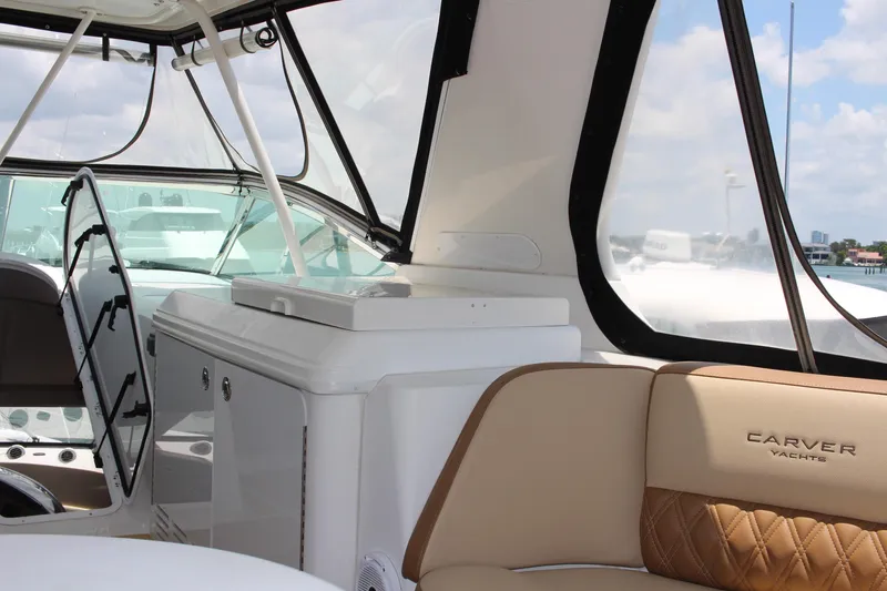 Slide: The Image of Interior of a 2006 Carver 560 Voyager yacht with beige seating and modern amenities. - 28