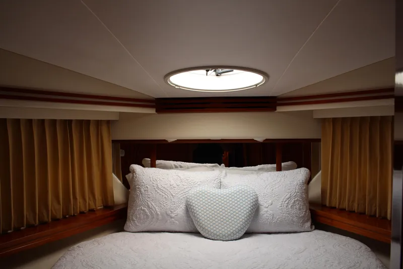 Slide: The Image of Luxurious bedroom interior of 2006 Carver 56 Voyager yacht with elegant bedding. - 47