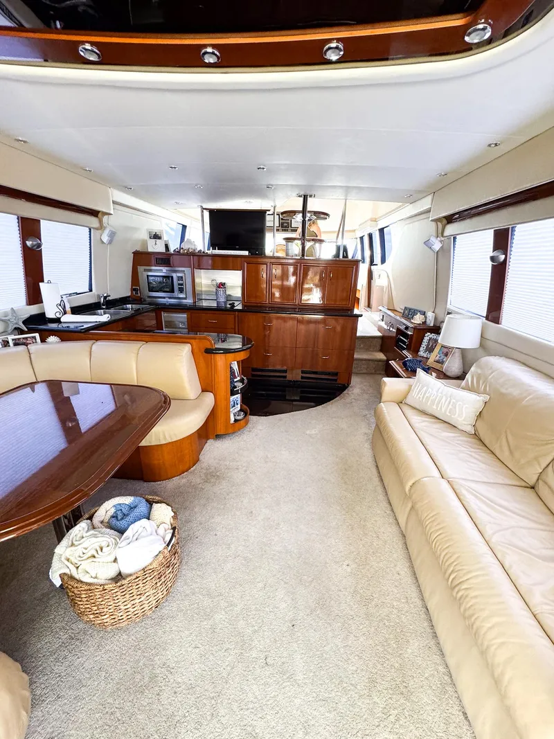 Slide: The Image of Interior of 2006 Carver 560 Voyager yacht with modern amenities and luxurious seating. - 6