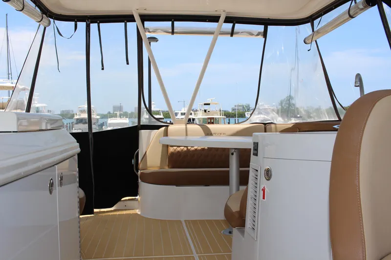 Slide: The Image of Interior of a 2006 Carver 560 Voyager yacht with seating and clear windows. - 19