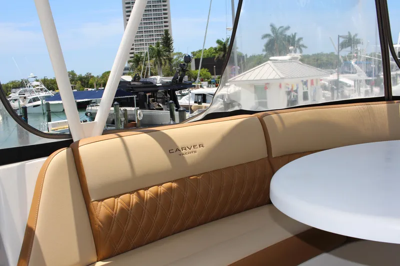 Slide: The Image of 2006 Carver 560 Voyager yacht interior seating area with marina view. - 21