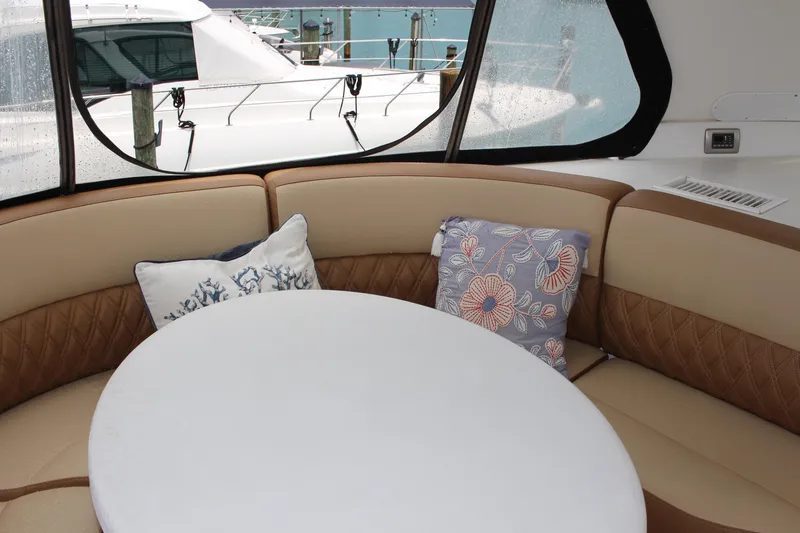 Slide: The Image of Interior seating area of a 2006 Carver 560 Voyager yacht with decorative pillows. - 22