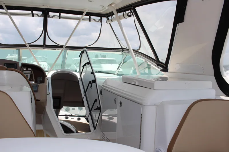 Slide: The Image of Interior of 2006 Carver 560 Voyager yacht with helm and seating area. - 26