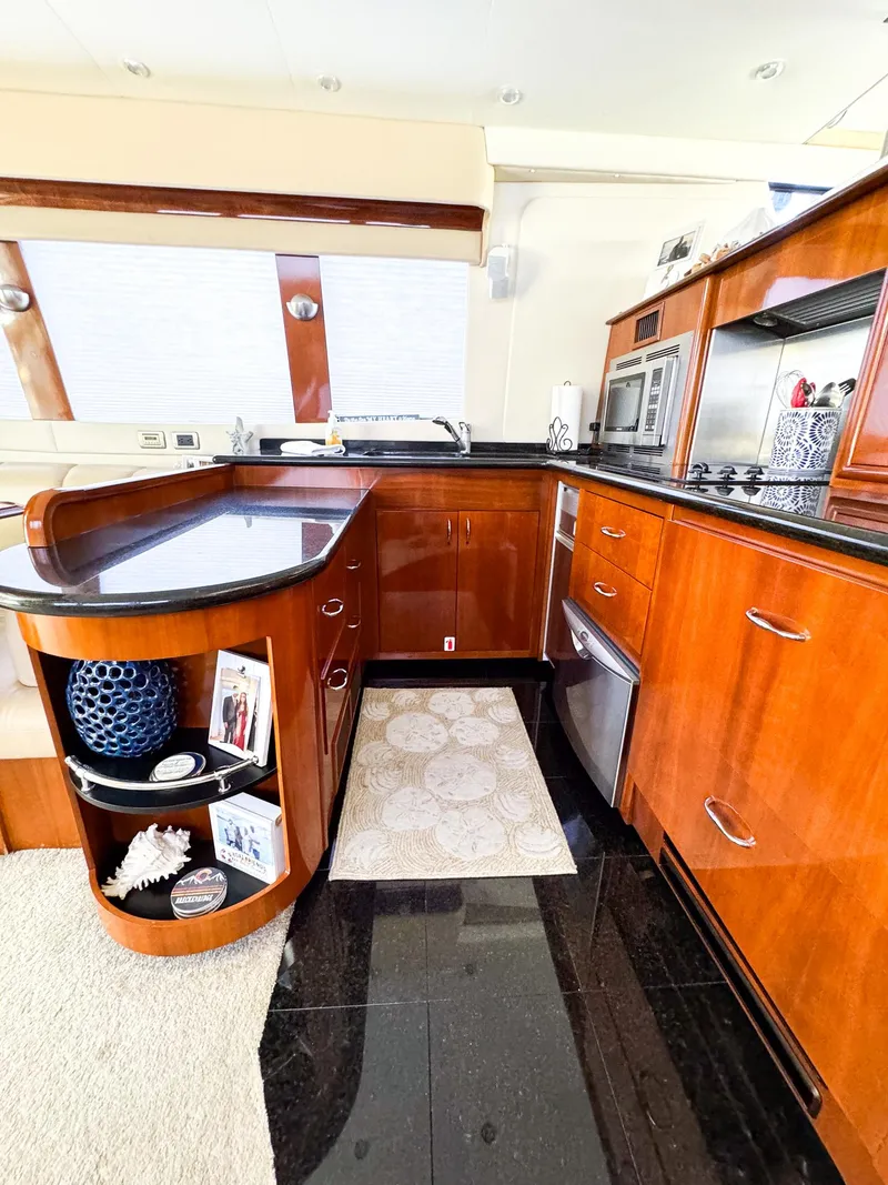 Slide: The Image of 2006 Carver 560 Voyager kitchen with modern appliances and wooden cabinetry. - 3