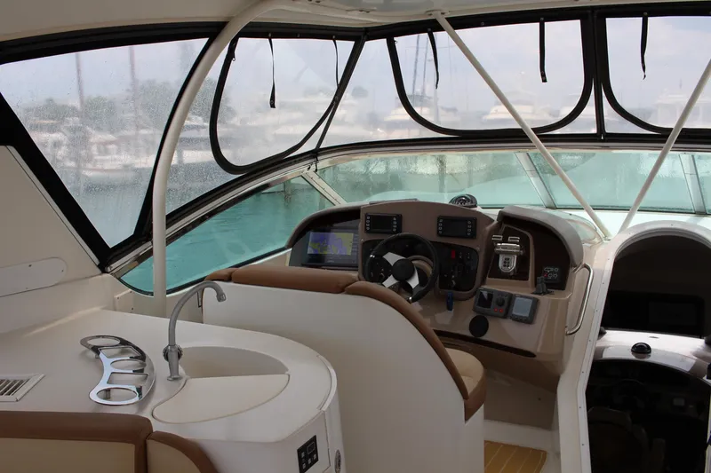 Slide: The Image of 2006 Carver 560 Voyager helm station with modern navigation equipment and panoramic windows. - 30