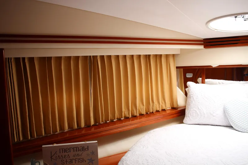 Slide: The Image of Luxurious cabin interior of 2006 Carver 56 Voyager yacht with cozy bedding. - 48