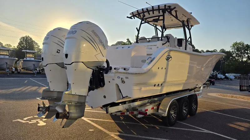 Slide: The Image of 2022 Sea Fox 328 Commander boat on a trailer with twin outboard engines. - 5