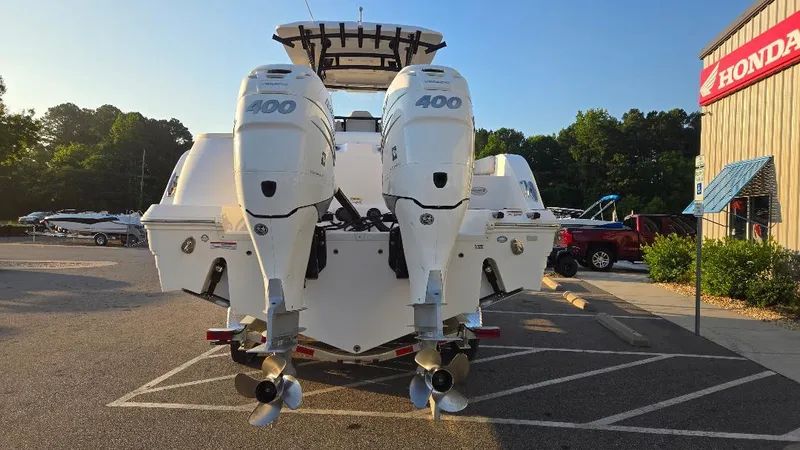 Slide: The Image of 2022 Sea Fox 328 Commander with twin 400 HP engines in a parking lot. - 6