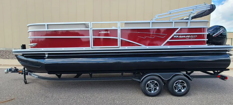 Slide: The Image of 2024 Ranger Reata 220C pontoon boat on trailer, side view. - 3