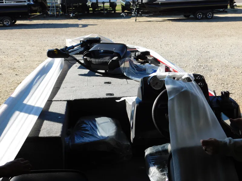 Slide: The Image of 2024 Tracker Pro 170 boat interior with covered seats and steering wheel. - 33