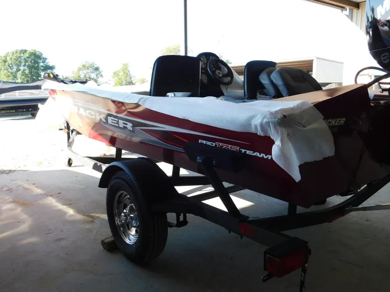 Slide: The Image of 2024 Tracker Pro 170 boat on trailer in a shaded area. - 37