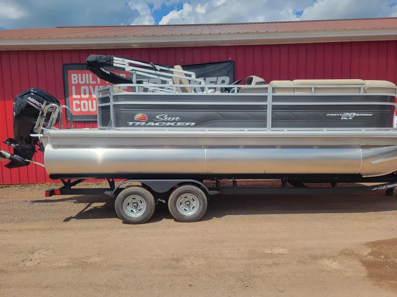 The Image of 2024 Sun Tracker Party Barge 20 DLX pontoon boat on trailer. - 0
