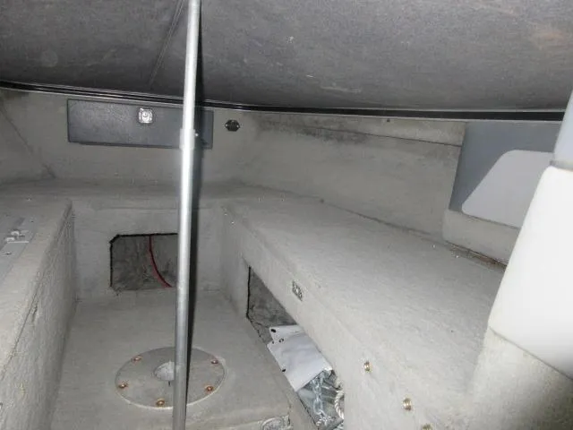 Slide: The Image of Interior of 1990 Lund 1850 Tyee Gran Sport boat showing storage compartments. - 13