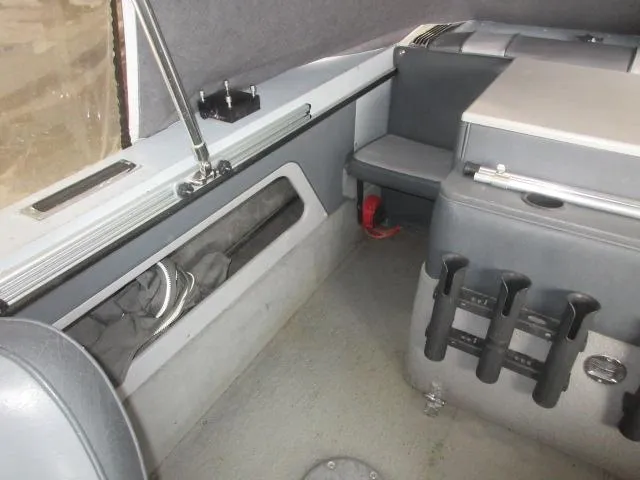 Slide: The Image of Interior of a 1990 Lund 1850 Tyee Gran Sport boat with storage compartments. - 18