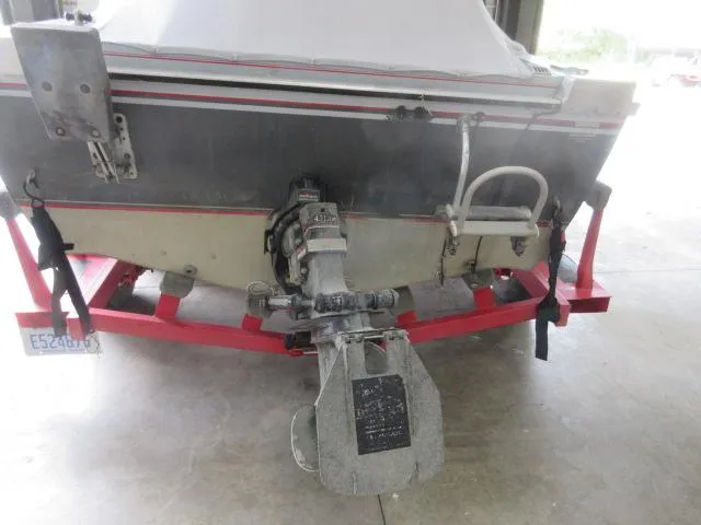 Slide: The Image of 1990 Lund 1850 Tyee Gran Sport boat on red trailer, rear view. - 6