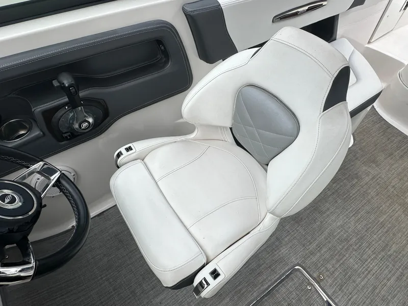 Slide: The Image of 2018 Chaparral 267 SSX boat captain's seat and steering wheel. - 10