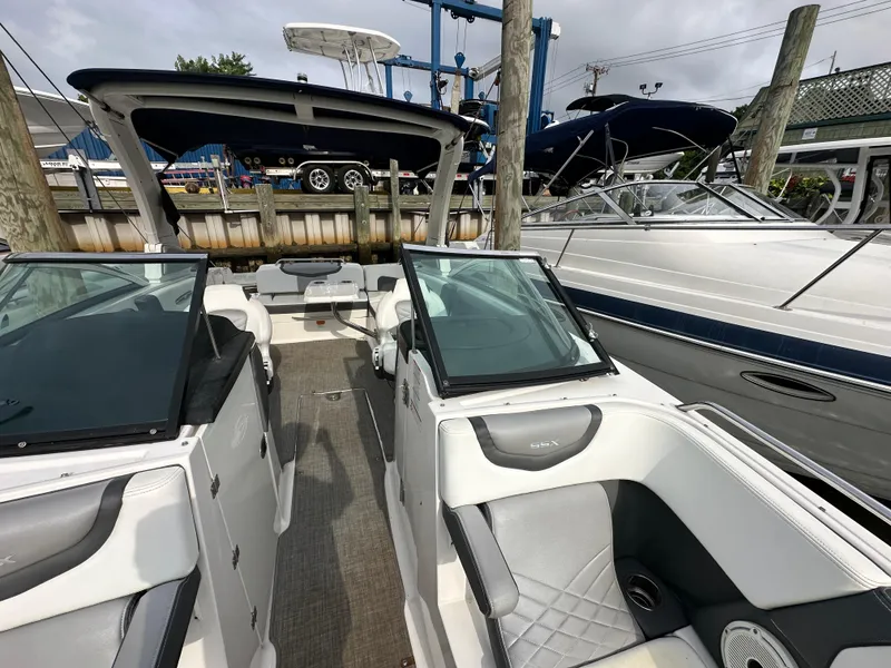 Slide: The Image of 2018 Chaparral 267 SSX boat interior at a marina. - 18