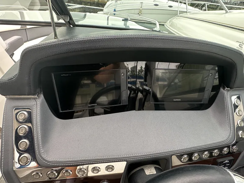 Slide: The Image of Dashboard of a 2018 Chaparral 267 SSX boat with dual Garmin displays. - 3