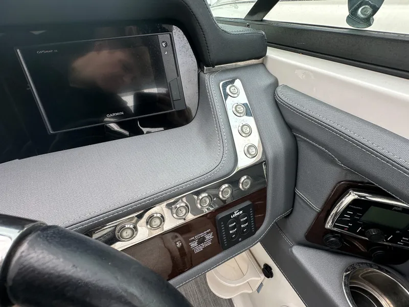 Slide: The Image of 2018 Chaparral 267 SSX boat dashboard with Garmin display and control panel. - 6
