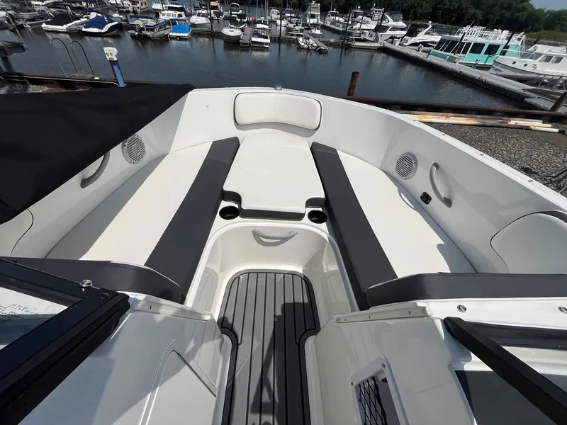 Slide: The Image of 2022 Bayliner VR4 Bowrider OB interior with seating, docked at marina. - 7