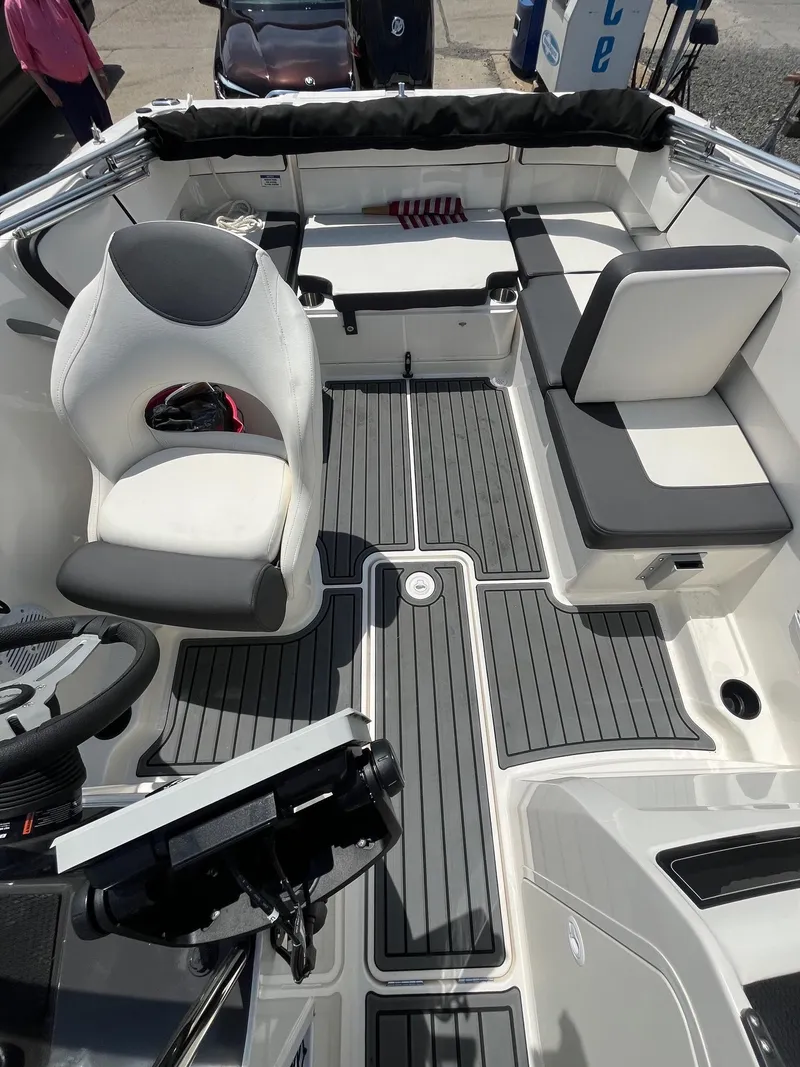 Slide: The Image of 2022 Bayliner VR4 Bowrider OB interior with seating and steering wheel. - 9