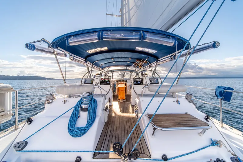 Slide: The Image of Luxurious 2010 Hylas 70 yacht deck with blue canopy and ocean view. - 10