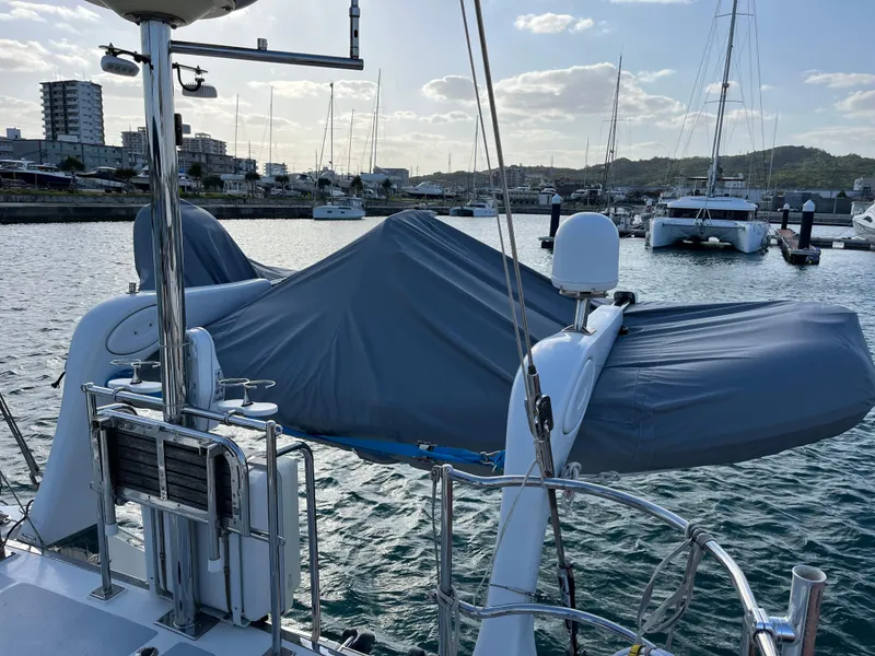 Slide: The Image of Sailboat docked in marina, Hylas 70 model, 2010, with covered equipment on deck. - 12