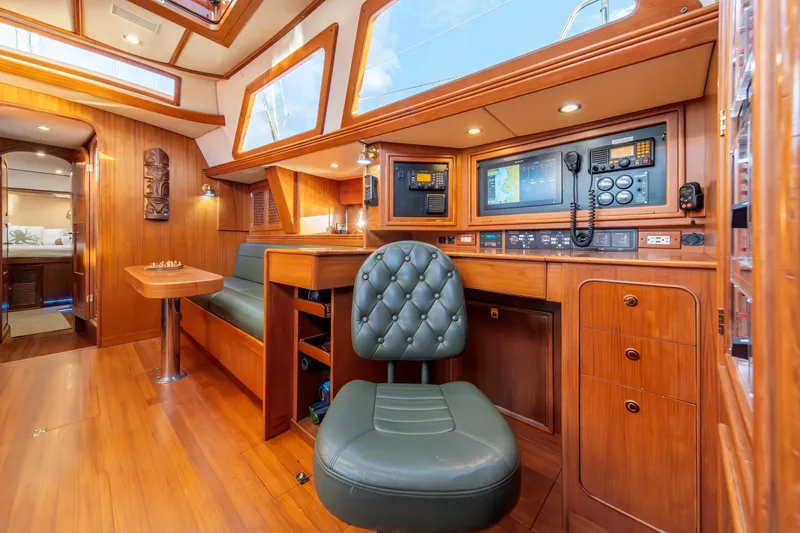 Slide: The Image of Luxurious interior of 2010 Hylas 70 yacht with navigation station and seating area. - 22