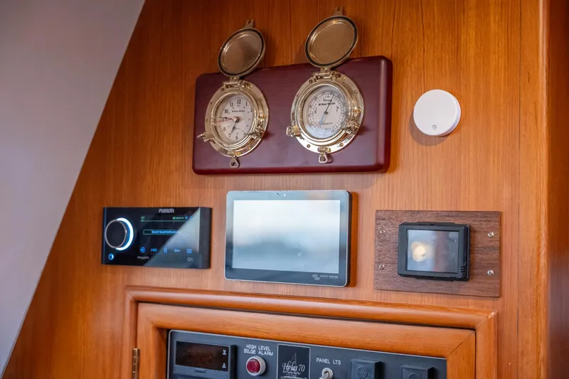 Slide: The Image of Control panel on a 2010 Hylas 70 yacht with gauges and electronic displays. - 23