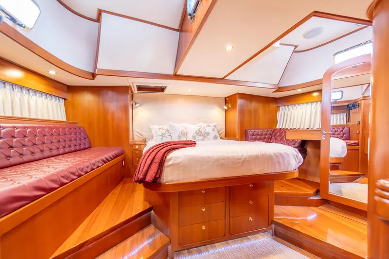 Slide: The Image of Luxurious cabin interior of a 2010 Hylas 70 yacht with elegant wood finishes. - 33