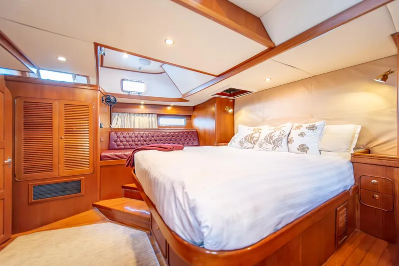 Slide: The Image of Luxurious cabin interior of a 2010 Hylas 70 yacht with elegant wood finish. - 36