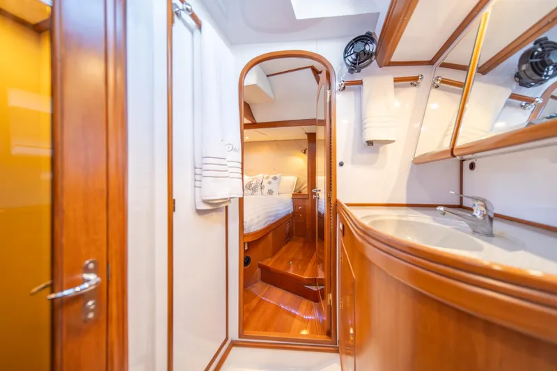 Slide: The Image of Luxurious interior of 2010 Hylas 70 yacht featuring wood finishes and elegant design. - 38