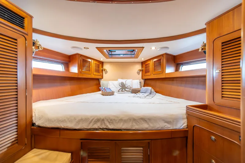 Slide: The Image of Luxurious cabin interior of 2010 Hylas 70 yacht with cozy bed and wooden finish. - 39