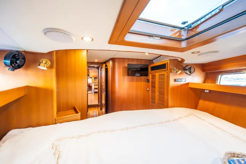 Slide: The Image of Luxurious cabin interior of a 2010 Hylas 70 yacht with wood paneling and skylight. - 41