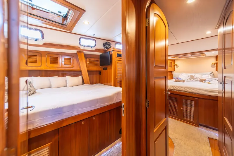 Slide: The Image of Luxurious interior of 2010 Hylas 70 yacht with wooden finish and cozy bedrooms. - 44