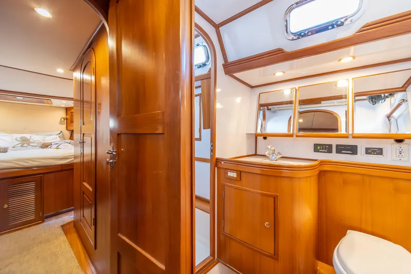 Slide: The Image of Luxurious Hylas 70 yacht interior, featuring elegant wood finishes and modern amenities, 2010 model. - 45
