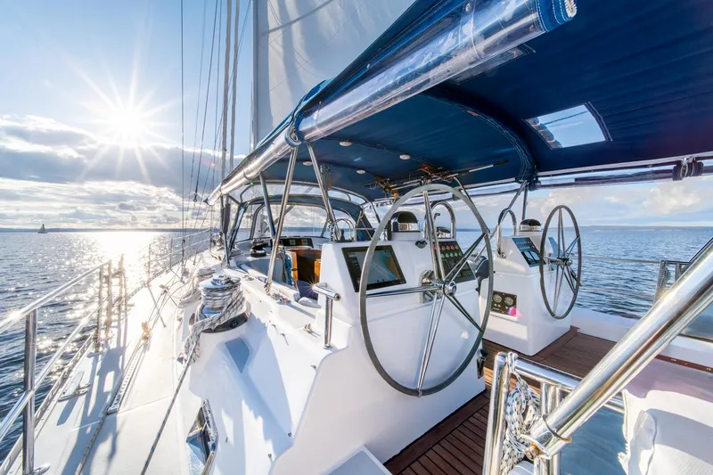 Slide: The Image of Luxurious 2010 Hylas 70 yacht sailing on open water at sunset. - 8