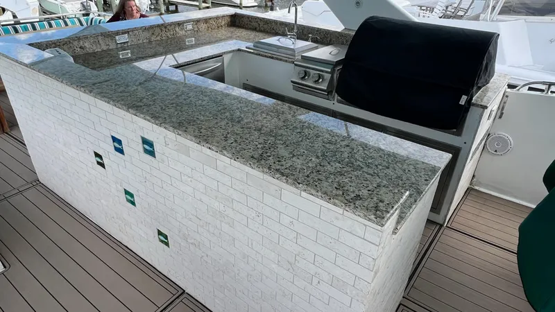 Slide: The Image of Outdoor kitchen on 1987 Hatteras Motoryacht with granite countertops and built-in grill. - 11