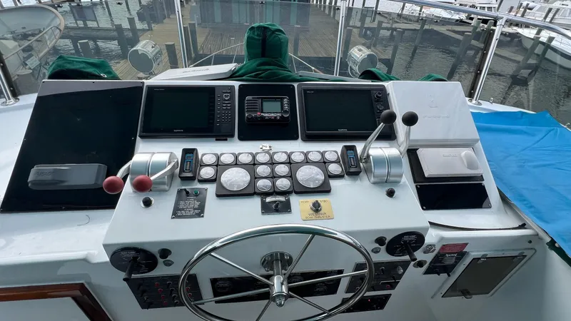Slide: The Image of 1987 Hatteras Motoryacht helm with navigation instruments and steering wheel. - 15